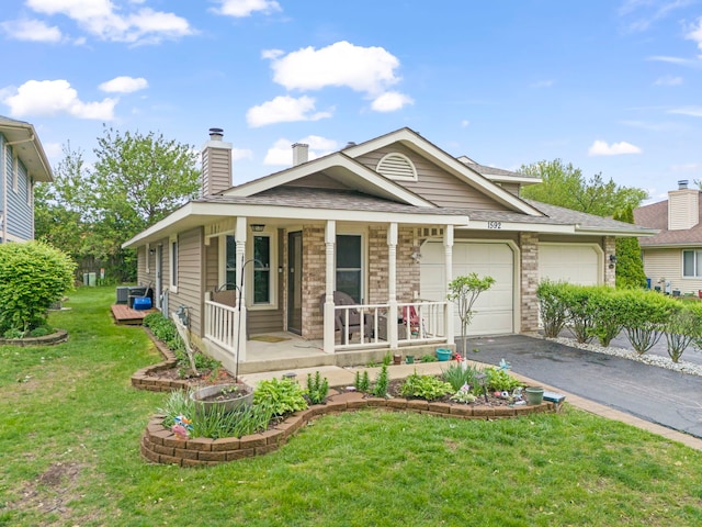 1592 Lighthouse Dr, Naperville, IL 60565 - single story home with driveway, a garage, covered porch, a front yard, and a chimney