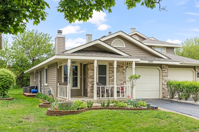 1592 Lighthouse Dr, Naperville, IL 60565 - view of front of house with an attached garage, covered porch, asphalt driveway, a front yard, and a chimney