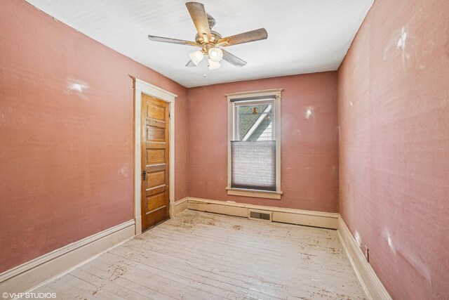 827 Lewis St, Dekalb, IL 60115 - unfurnished room with hardwood / wood-style floors, a ceiling fan, and baseboards