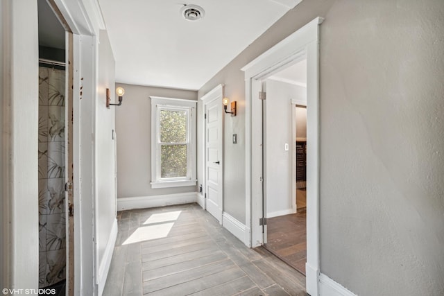827 Lewis St, Dekalb, IL 60115 - hallway featuring wood finished floors and baseboards