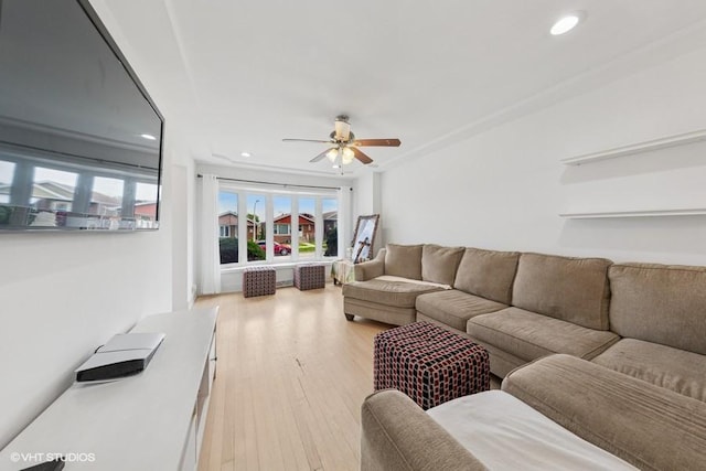 living area with a ceiling fan, light wood-type flooring, and recessed lighting