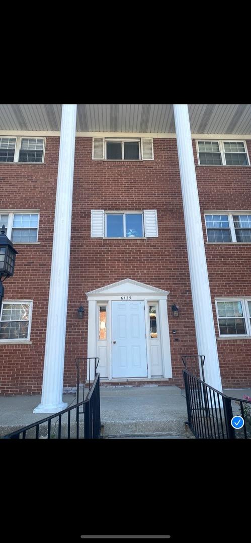 6135 W 94th St Unit C6, Oak Lawn, IL 60453 - view of front of home featuring brick siding