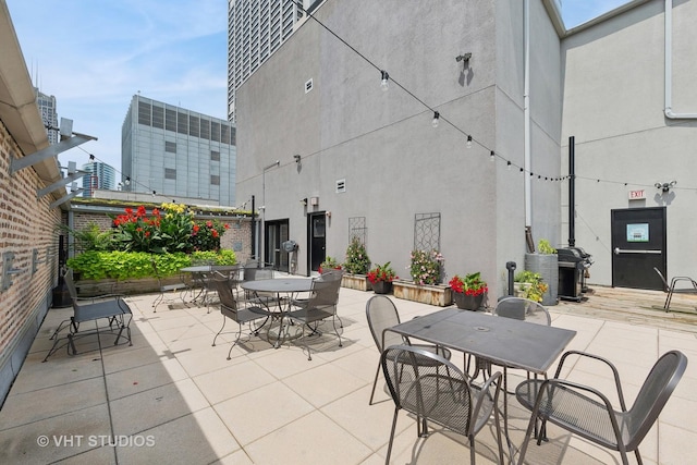 8 W Monroe St Unit 1205, Chicago, IL 60603 - view of patio / terrace featuring outdoor dining area and area for grilling