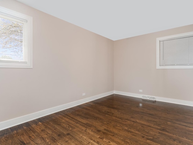1331 W 112th St, Chicago, IL 60643 - spare room featuring baseboards and dark wood finished floors