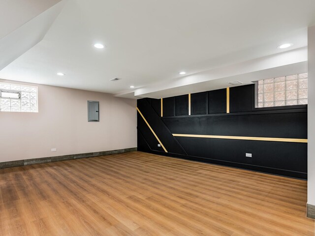 1331 W 112th St, Chicago, IL 60643 - below grade area with light wood-style flooring, electric panel, recessed lighting, and baseboards
