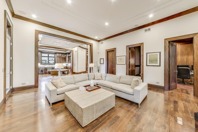 6535 N Tower Circle Dr, Lincolnwood, IL 60712 - living room featuring wood finished floors, baseboards, ornamental molding, and recessed lighting