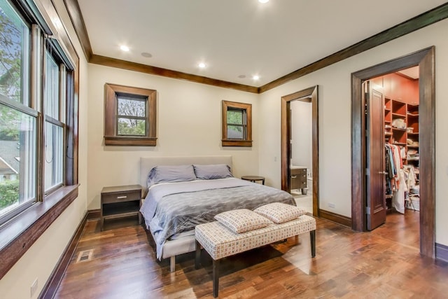 6535 N Tower Circle Dr, Lincolnwood, IL 60712 - bedroom with a spacious closet, wood finished floors, baseboards, crown molding, and recessed lighting