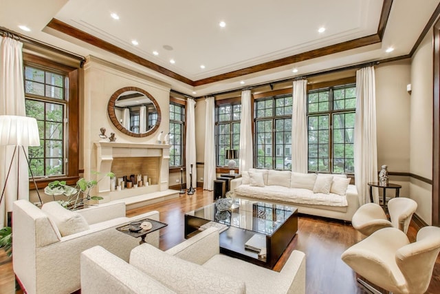 6535 N Tower Circle Dr, Lincolnwood, IL 60712 - living area featuring crown molding, wood finished floors, recessed lighting, a raised ceiling, and a high end fireplace