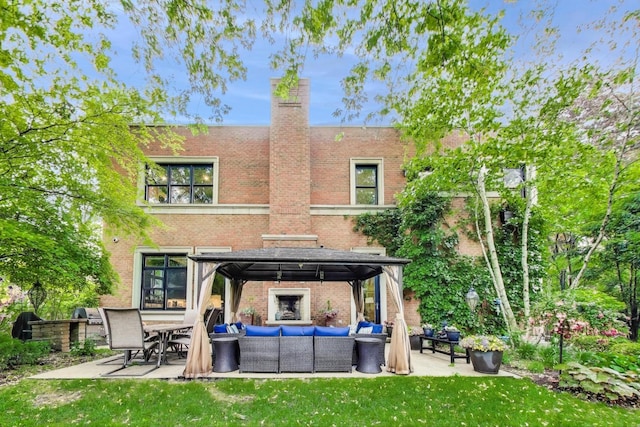 6535 N Tower Circle Dr, Lincolnwood, IL 60712 - back of property featuring an outdoor hangout area, a gazebo, brick siding, and a patio area
