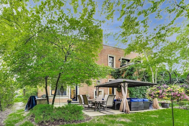 6535 N Tower Circle Dr, Lincolnwood, IL 60712 - rear view of property with a patio and brick siding