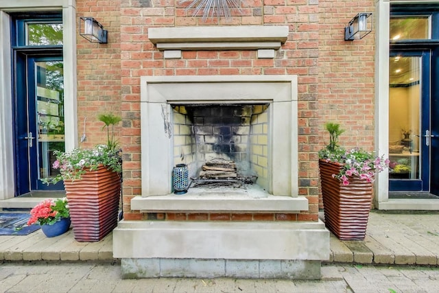6535 N Tower Circle Dr, Lincolnwood, IL 60712 - entrance to property with brick siding and a fireplace with raised hearth