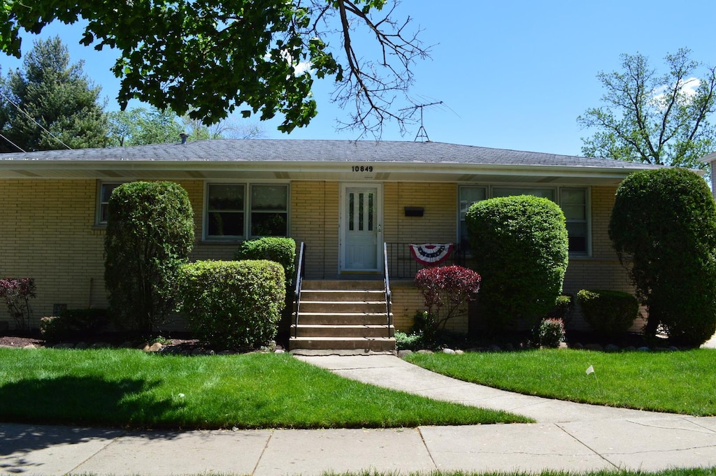 10849 S Christiana Ave, Chicago, IL 60655 - view of front of house with brick siding and a front yard