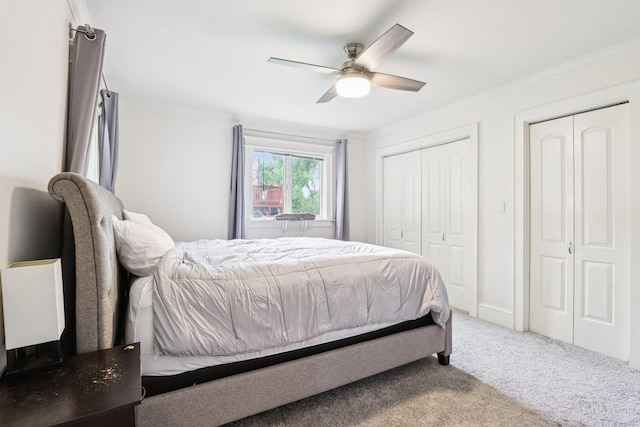 38 Highview Ave, Fox Lake, IL 60020 - bedroom featuring ornamental molding, carpet flooring, two closets, and a ceiling fan
