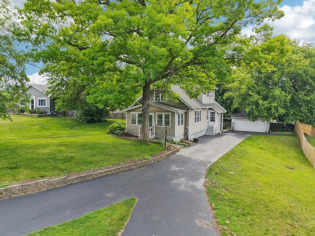 38 Highview Ave, Fox Lake, IL 60020 - view of front facade with an outdoor structure and a detached garage