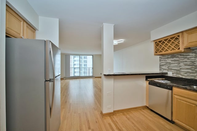 6007 N Sheridan Rd Unit 25F, Chicago, IL 60660 - kitchen with stainless steel appliances, decorative backsplash, light wood finished floors, and light brown cabinets
