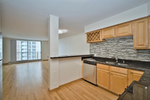 6007 N Sheridan Rd Unit 25F, Chicago, IL 60660 - kitchen with stainless steel dishwasher, a sink, light wood-style flooring, and decorative backsplash