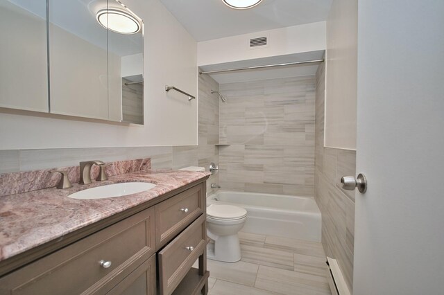 6007 N Sheridan Rd Unit 25F, Chicago, IL 60660 - bathroom featuring toilet, vanity, a baseboard radiator, and shower / bath combination