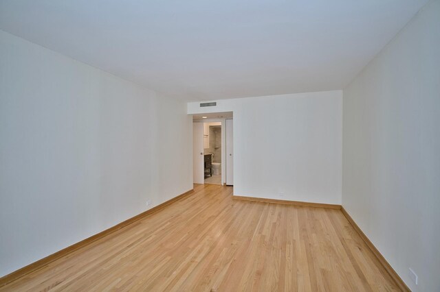 6007 N Sheridan Rd Unit 25F, Chicago, IL 60660 - spare room with light wood-type flooring and baseboards