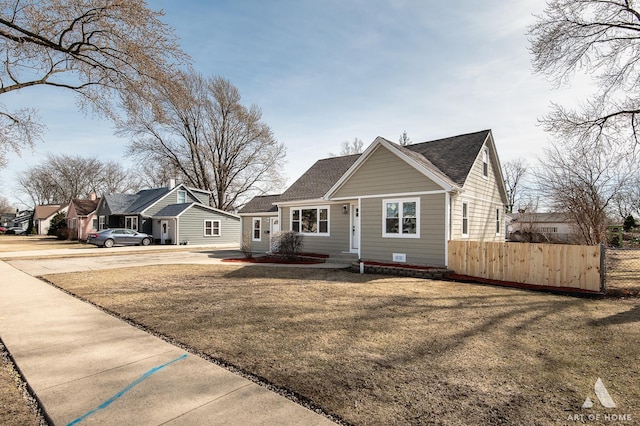 bungalow featuring roof with shingles and concrete driveway