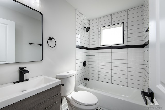 bathroom with toilet,  shower combination, and vanity