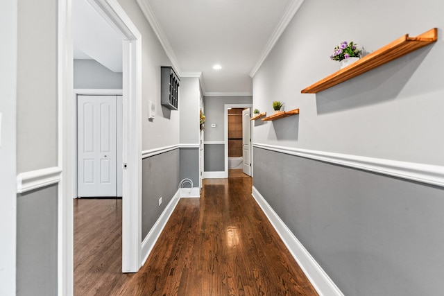 corridor with ornamental molding, dark wood-style flooring, recessed lighting, and baseboards