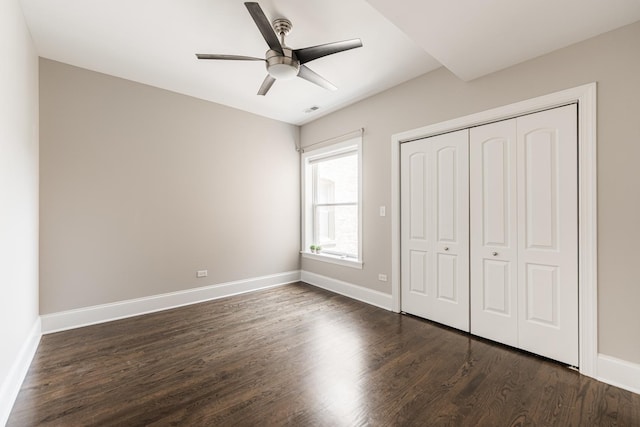 6337 N Magnolia Ave Unit 2, Chicago, IL 60660 - unfurnished bedroom featuring dark wood-style floors, a closet, and a ceiling fan