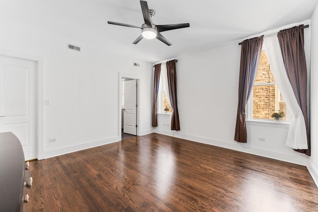 interior space featuring healthy amount of natural light, a ceiling fan, and wood finished floors