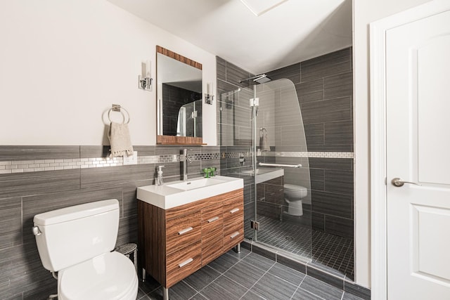6337 N Magnolia Ave Unit 2, Chicago, IL 60660 - full bath with vanity, a shower stall, tile patterned floors, and tile walls