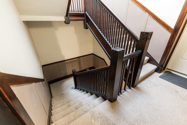 6337 N Magnolia Ave Unit 2, Chicago, IL 60660 - stairway featuring carpet floors and a decorative wall