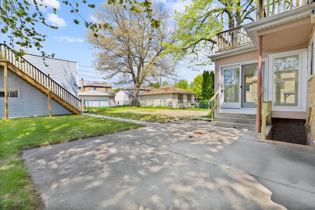 7810 Kildare Ave, Skokie, IL 60076 - view of patio with entry steps and a balcony