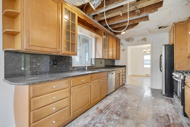 7810 Kildare Ave, Skokie, IL 60076 - kitchen with stainless steel appliances, open shelves, tasteful backsplash, a sink, and light wood-style floors