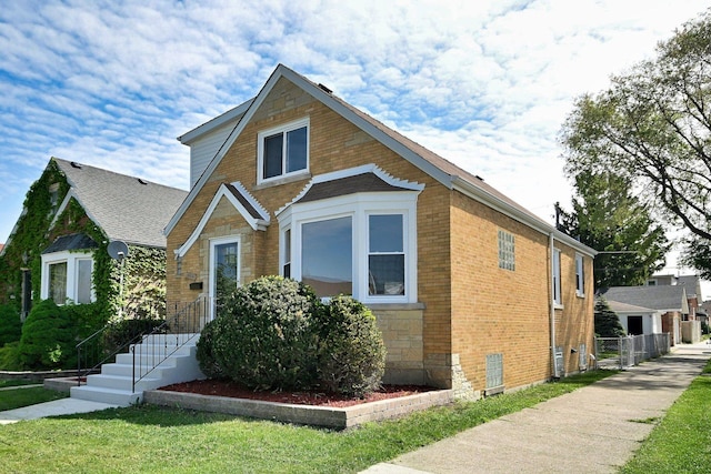 3001 N Neenah Ave, Chicago, IL 60634 - tudor-style house with stone siding and brick siding