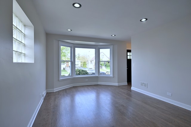 3001 N Neenah Ave, Chicago, IL 60634 - unfurnished room featuring recessed lighting, dark wood finished floors, and baseboards
