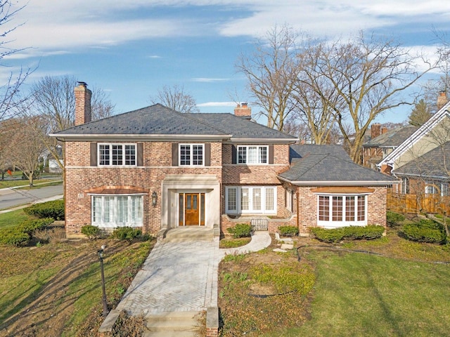471 Stagecoach, Glen Ellyn, IL 60137 - colonial inspired home with a chimney, brick siding, and a front lawn