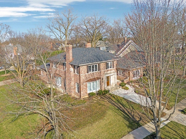 471 Stagecoach, Glen Ellyn, IL 60137 - view of front of property with an attached garage, a chimney, driveway, brick siding, and a front lawn