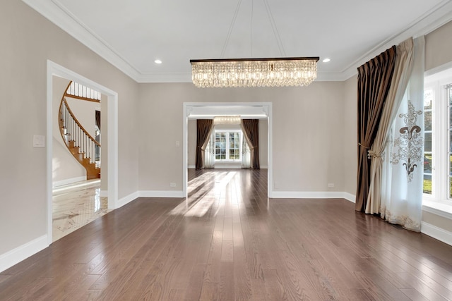 471 Stagecoach, Glen Ellyn, IL 60137 - unfurnished dining area featuring a chandelier, dark wood-style flooring, crown molding, stairway, and baseboards
