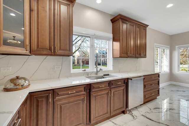 471 Stagecoach, Glen Ellyn, IL 60137 - kitchen with light marble finish flooring, stainless steel dishwasher, a sink, light stone counters, and backsplash