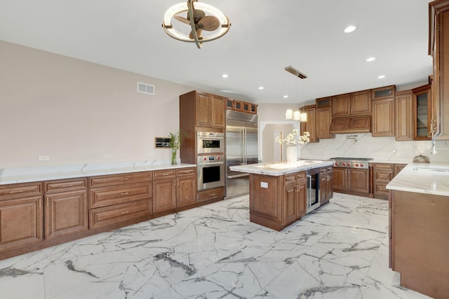 471 Stagecoach, Glen Ellyn, IL 60137 - kitchen with appliances with stainless steel finishes, brown cabinets, recessed lighting, a center island, and a sink