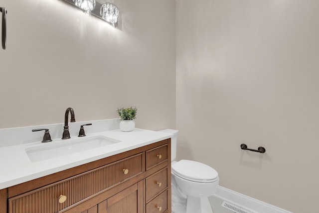 471 Stagecoach, Glen Ellyn, IL 60137 - bathroom featuring toilet, baseboards, and vanity