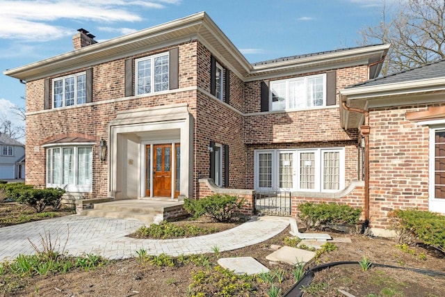 471 Stagecoach, Glen Ellyn, IL 60137 - view of front facade with brick siding, a chimney, and french doors