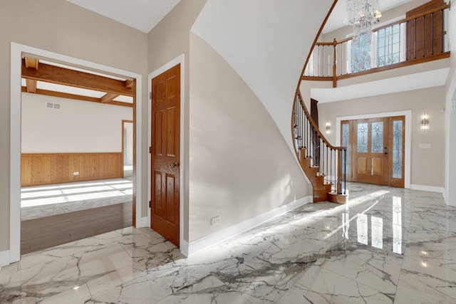 471 Stagecoach, Glen Ellyn, IL 60137 - foyer entrance featuring marble tiled flooring, stairs, wainscoting, a chandelier, and baseboards