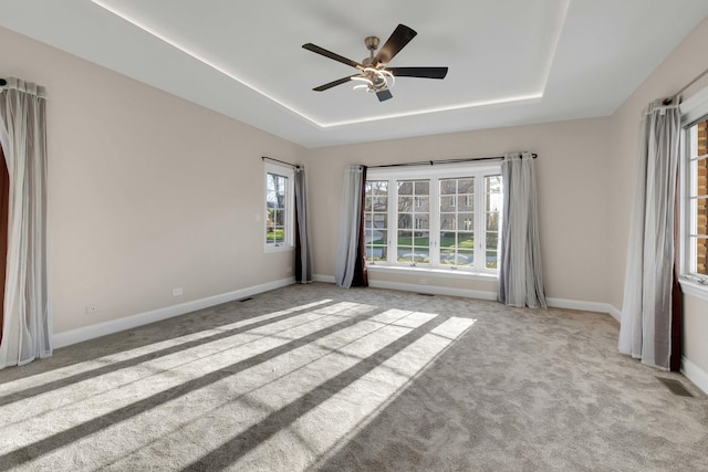 471 Stagecoach, Glen Ellyn, IL 60137 - carpeted spare room with a tray ceiling, ceiling fan, and baseboards