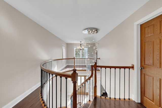 471 Stagecoach, Glen Ellyn, IL 60137 - staircase featuring a chandelier, wood finished floors, and baseboards
