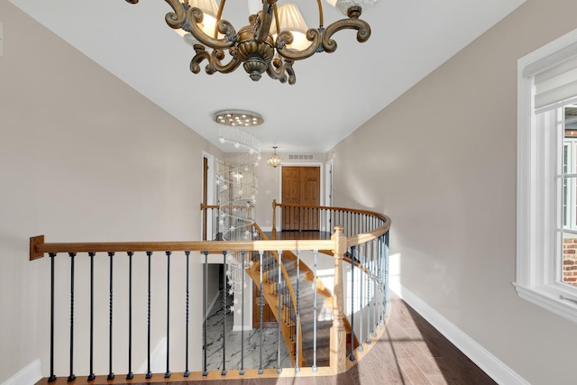 471 Stagecoach, Glen Ellyn, IL 60137 - stairway featuring a chandelier, baseboards, and wood finished floors
