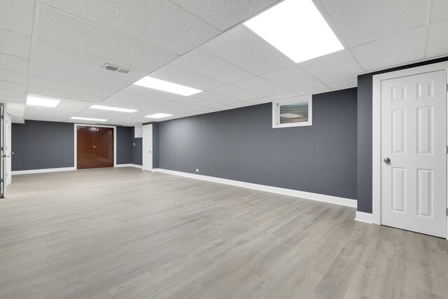 471 Stagecoach, Glen Ellyn, IL 60137 - finished below grade area with a paneled ceiling, baseboards, and light wood finished floors