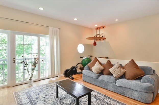 living area featuring wood finished floors and recessed lighting