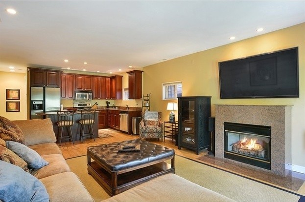 living room featuring recessed lighting and a fireplace