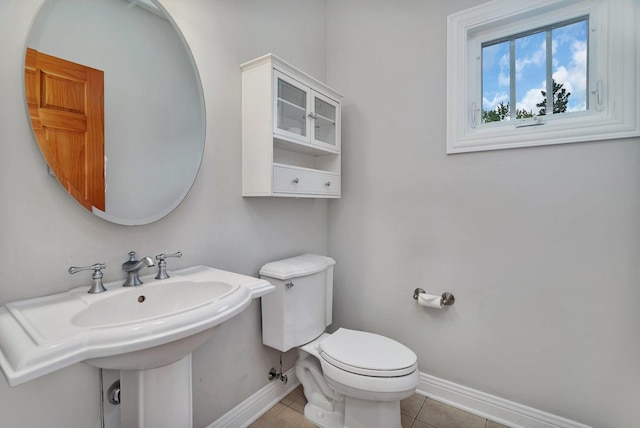 28 S Van Nortwick Ave, Batavia, IL 60510 - half bath featuring baseboards, toilet, and tile patterned flooring
