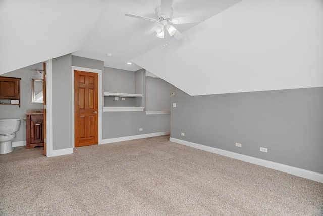 28 S Van Nortwick Ave, Batavia, IL 60510 - bonus room with vaulted ceiling, light colored carpet, ceiling fan, baseboards, and built in shelves