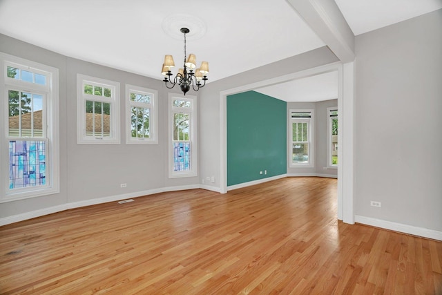 28 S Van Nortwick Ave, Batavia, IL 60510 - spare room with a chandelier, light wood-style floors, and baseboards